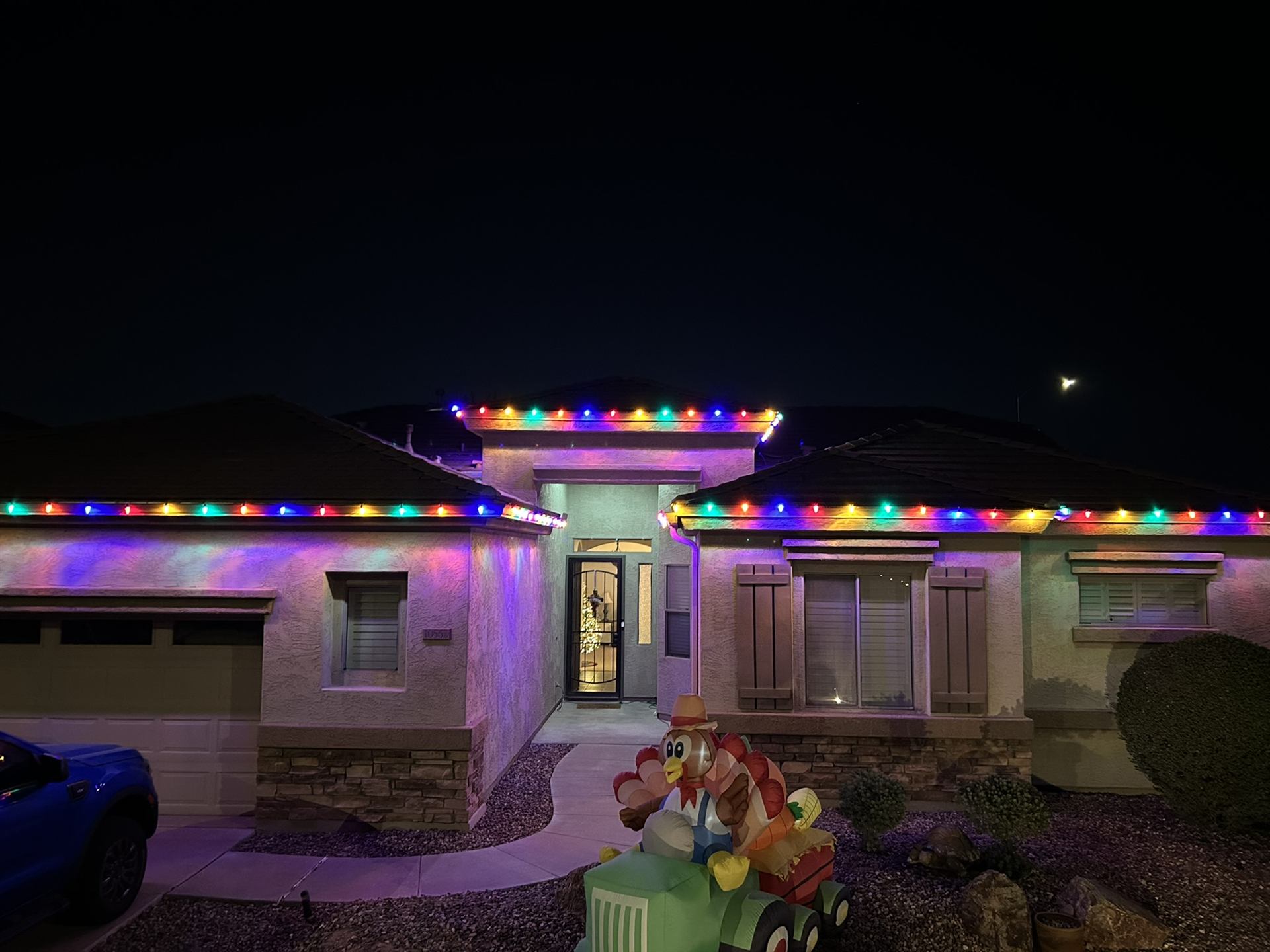 Multicolor holiday lighting on single-story house