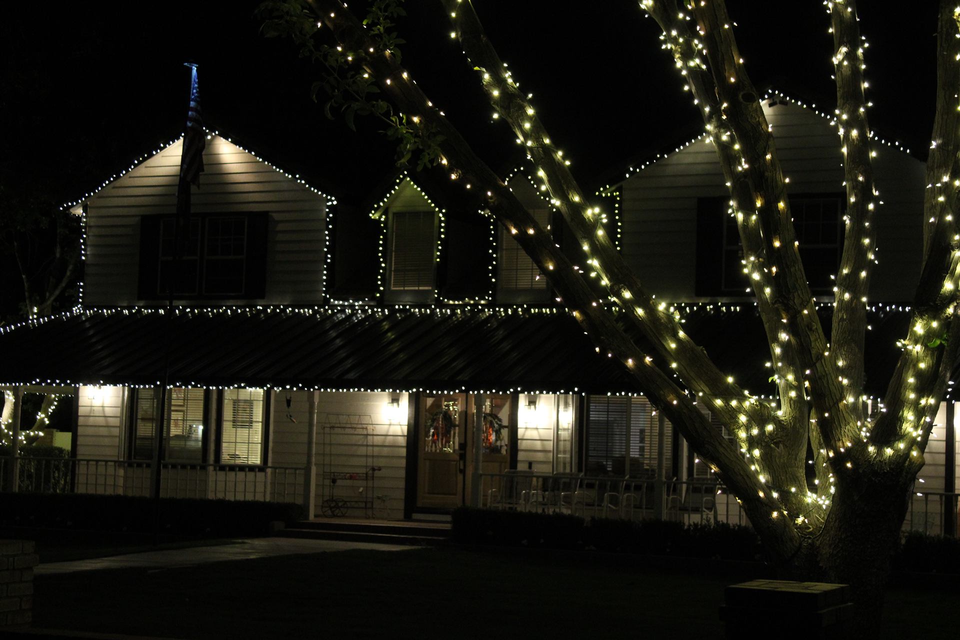 Custom two-story holiday lighting installation